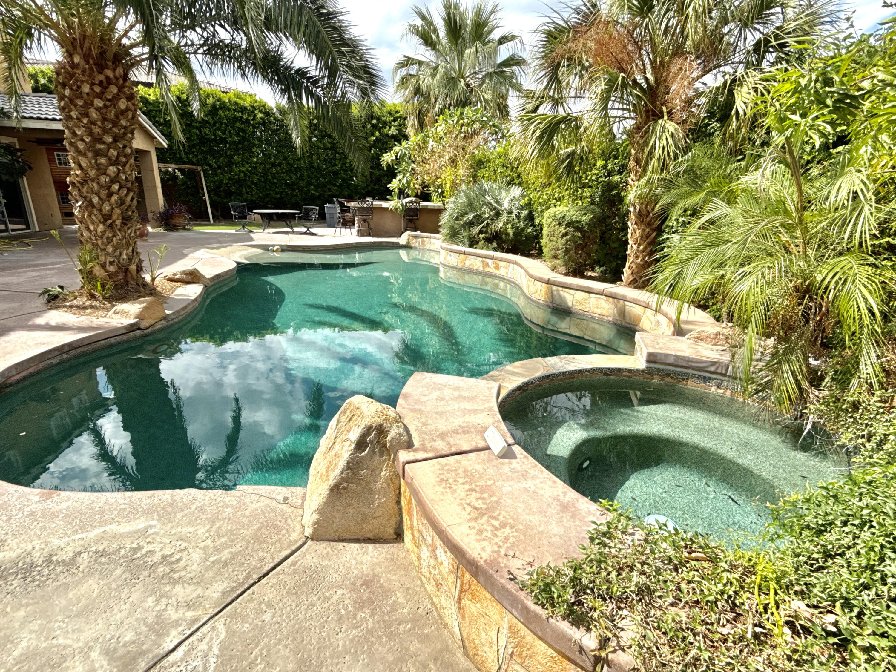 82546 Tivoli Court Indio, CA 92203 - Photo 4 of 19 a view of swimming pool from a garden