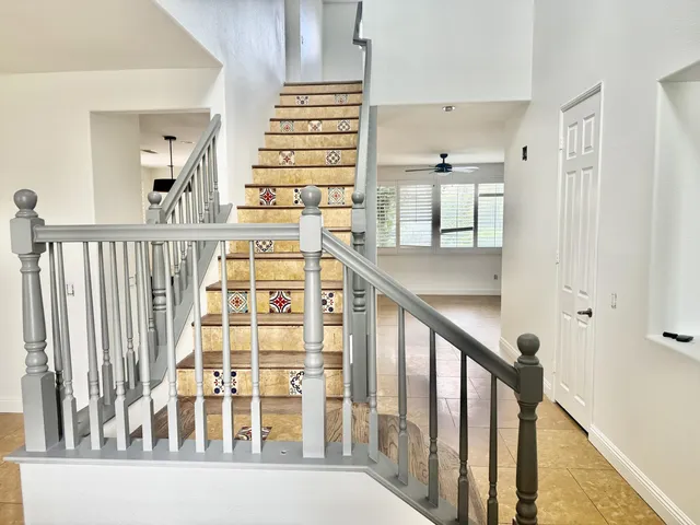 a view of a balcony with wooden floor and stairs