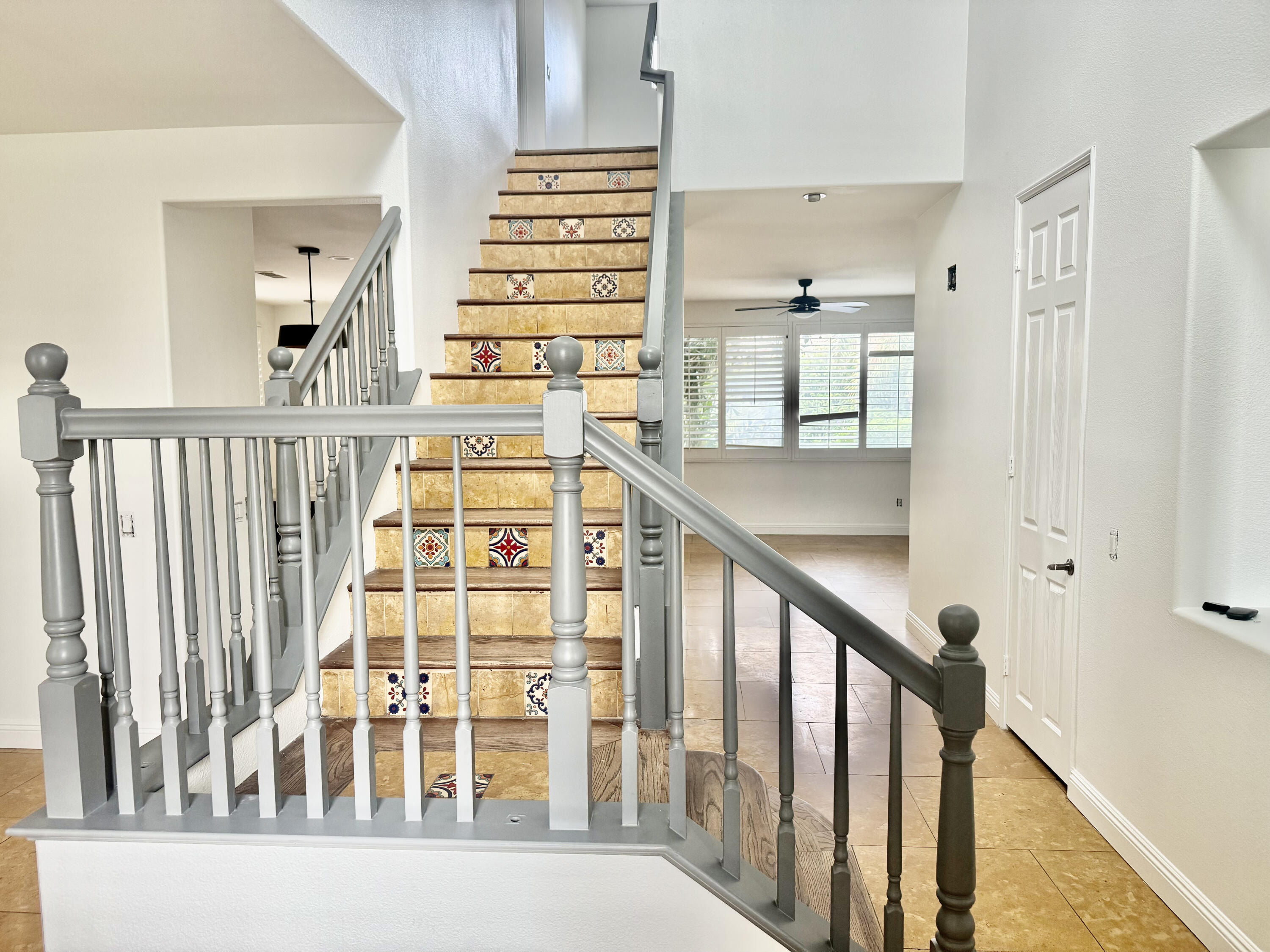 82546 Tivoli Court Indio, CA 92203 - Photo 8 of 19 a view of a balcony with wooden floor and stairs