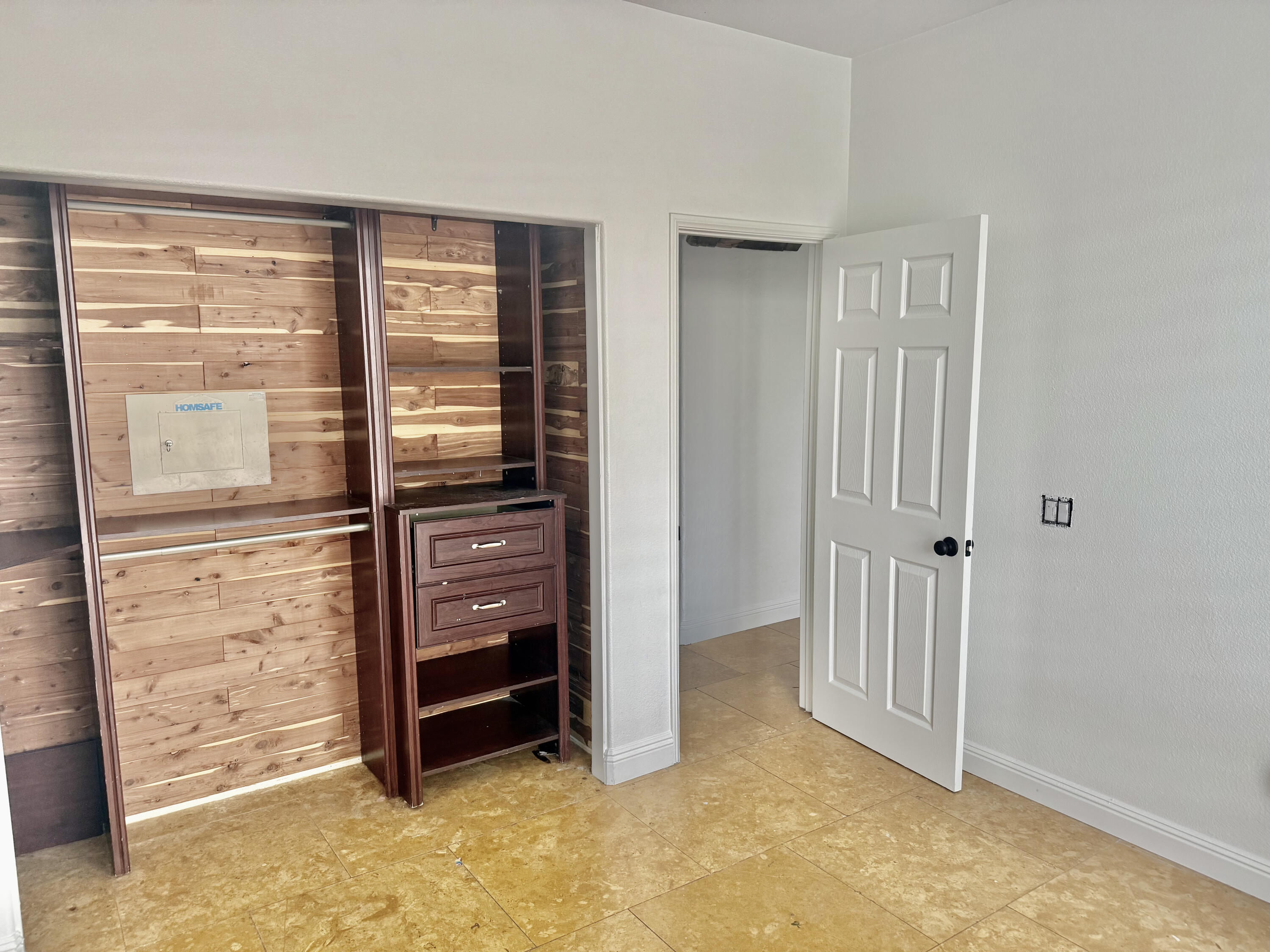 82546 Tivoli Court Indio, CA 92203 - Photo 10 of 19 a view of walk in closet with empty racks