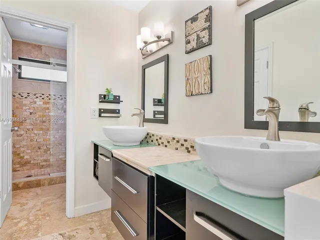 a bathroom with a sink and a mirror