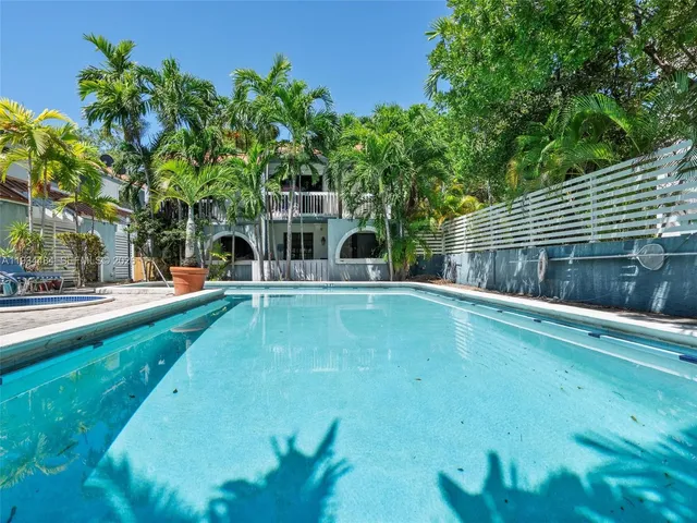 a view of a swimming pool with a patio
