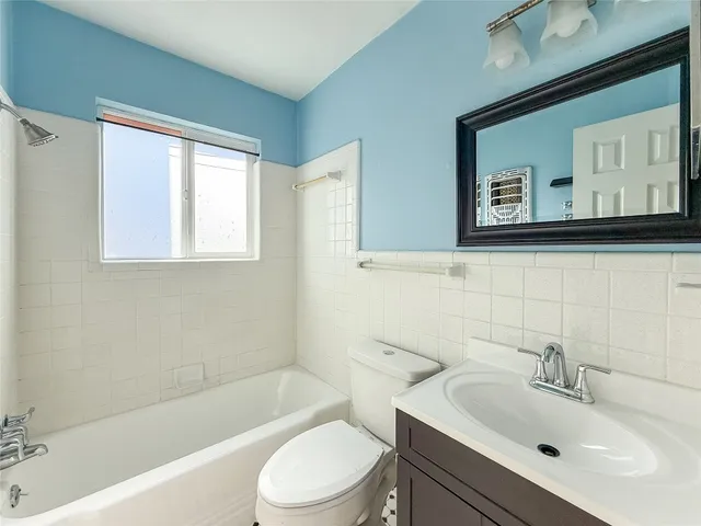a bathroom with a sink toilet and bathtub