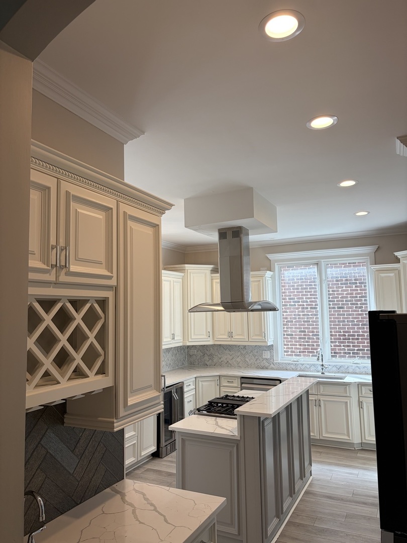 7381 South Madison Street Burr Ridge, IL 60527 - Photo 15 of 30 a kitchen with a stove a sink and a refrigerator