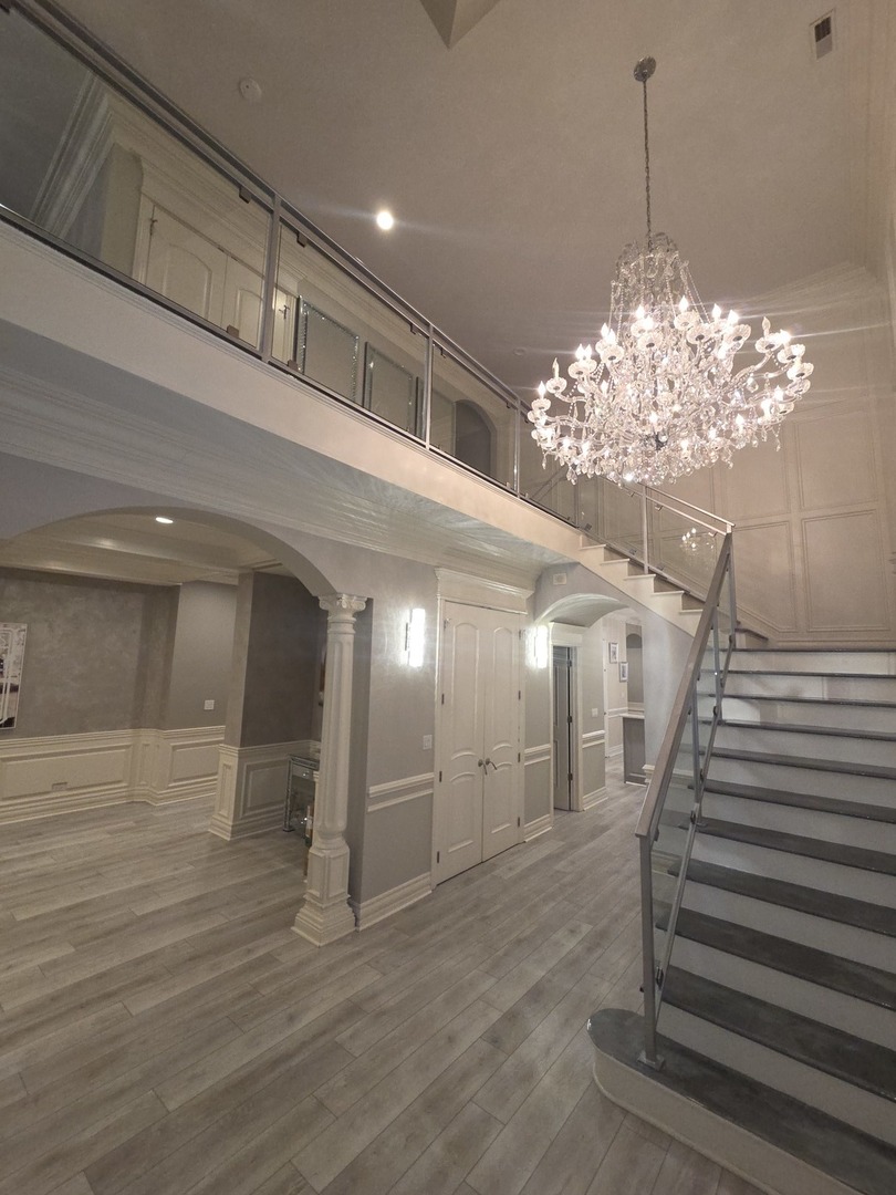 7381 South Madison Street Burr Ridge, IL 60527 - Photo 2 of 30 a view of a hallway with stairs