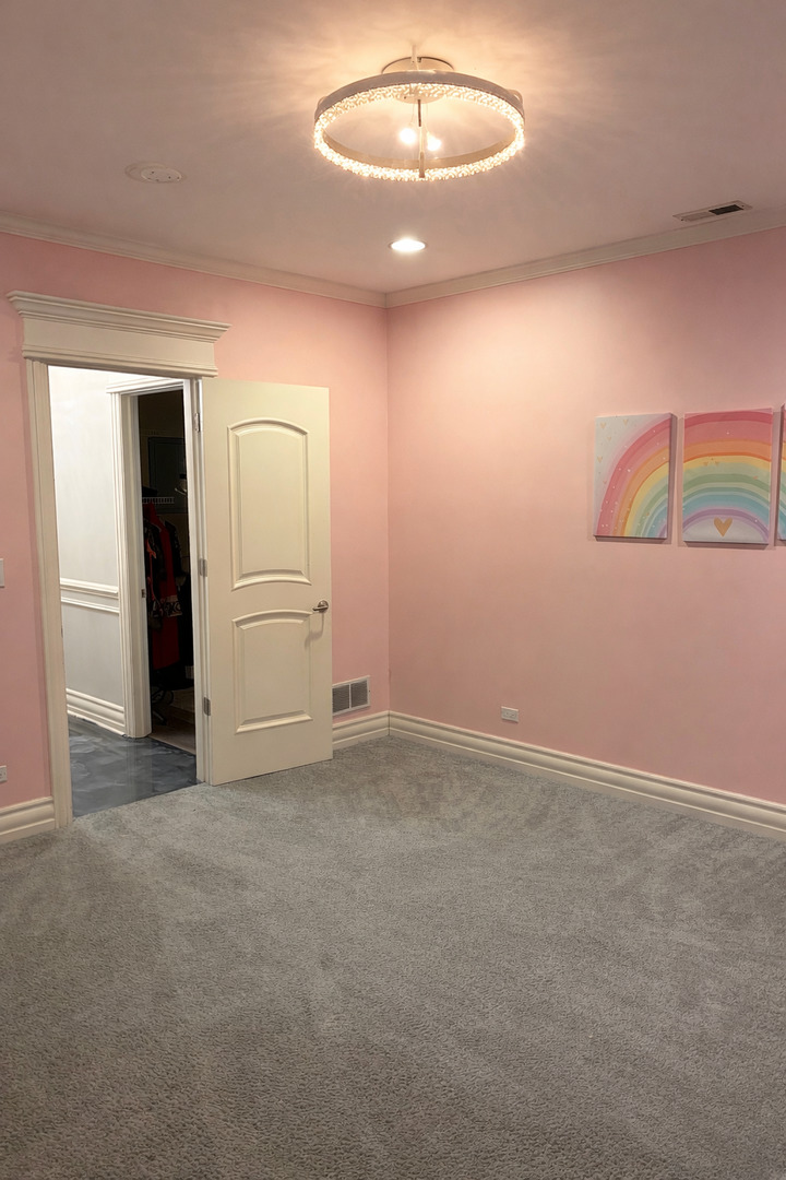 7381 South Madison Street Burr Ridge, IL 60527 - Photo 22 of 30 an empty room with a empty space and wooden floor