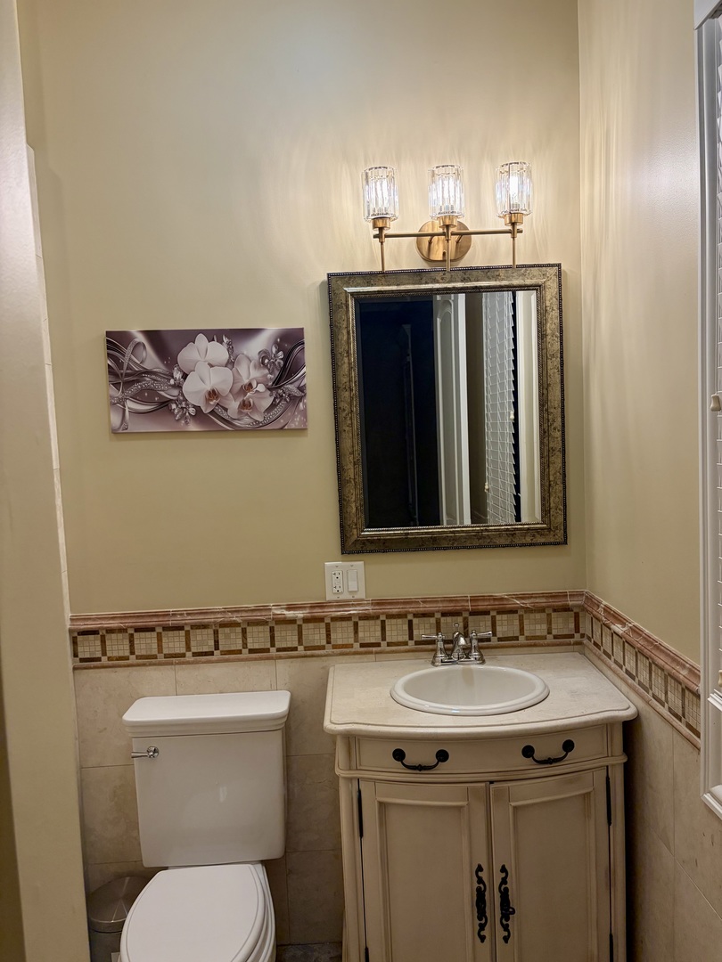 7381 South Madison Street Burr Ridge, IL 60527 - Photo 23 of 30 a bathroom with a sink and a toilet
