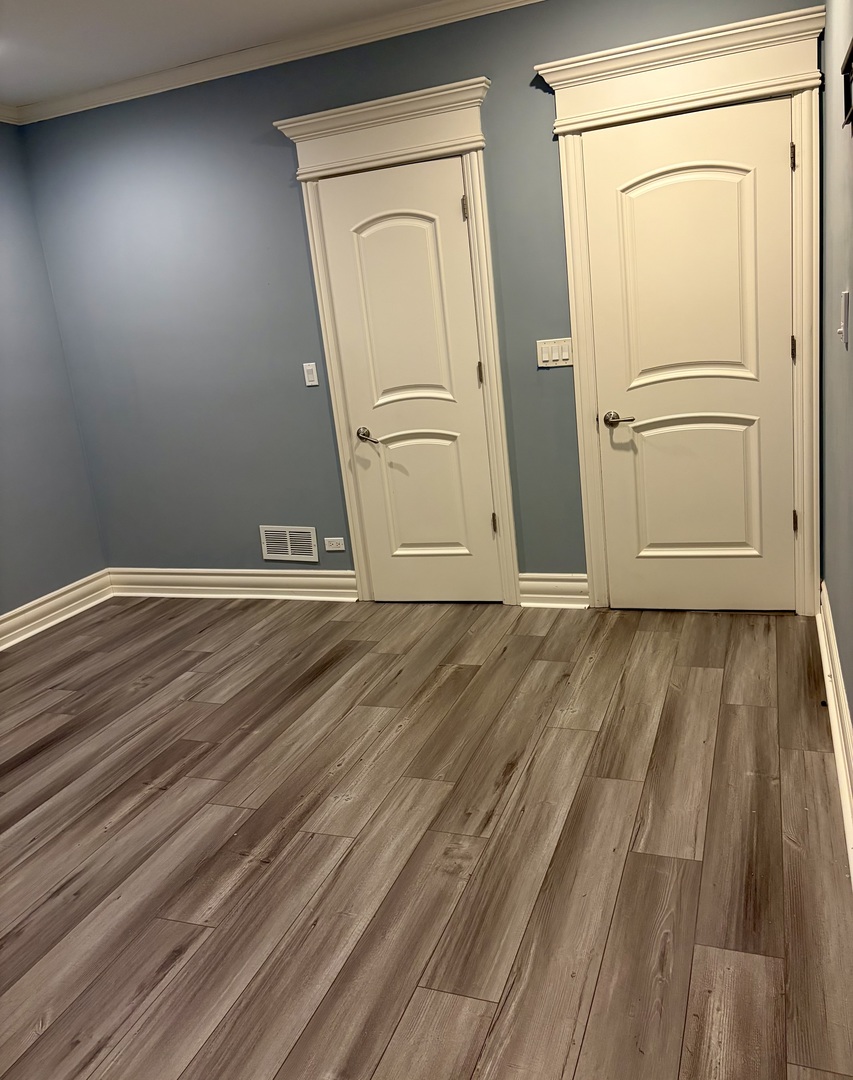 7381 South Madison Street Burr Ridge, IL 60527 - Photo 24 of 30 a view of front door with wooden floor
