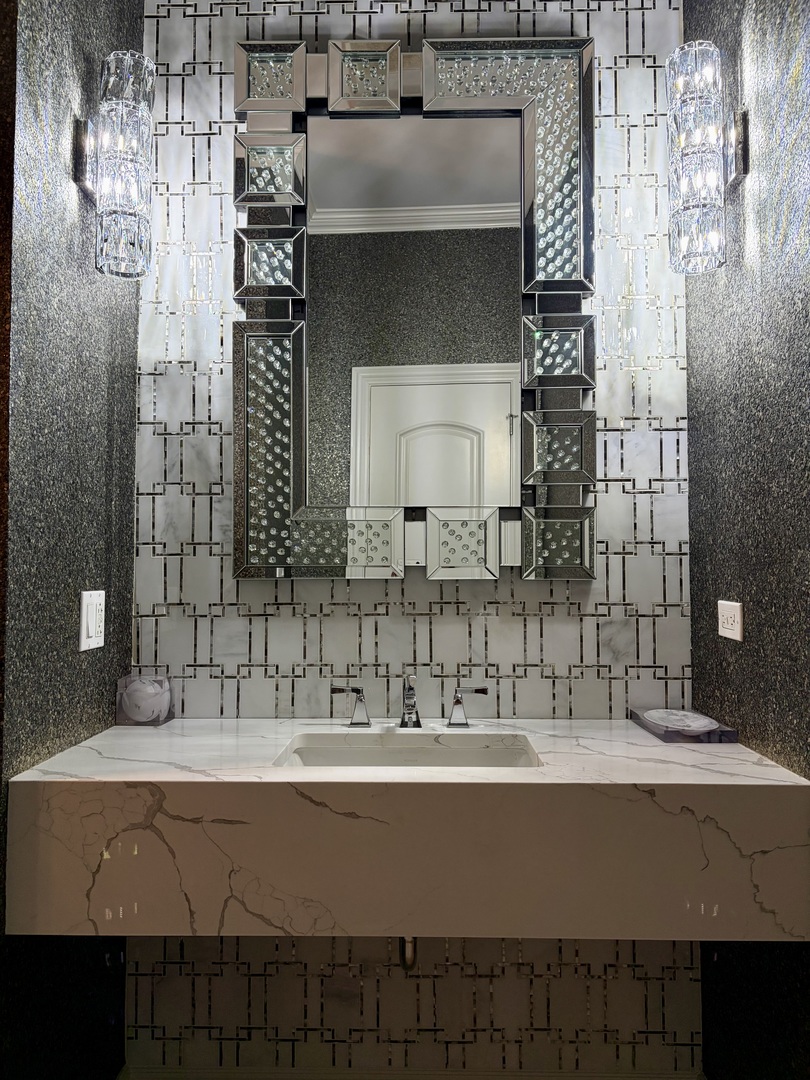 7381 South Madison Street Burr Ridge, IL 60527 - Photo 8 of 30 a bathroom with a sink and a mirror
