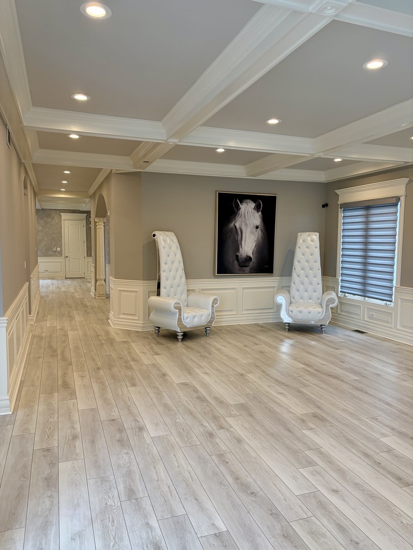 7381 South Madison Street Burr Ridge, IL 60527 - Photo 10 of 30 a living room with furniture and a wooden floor