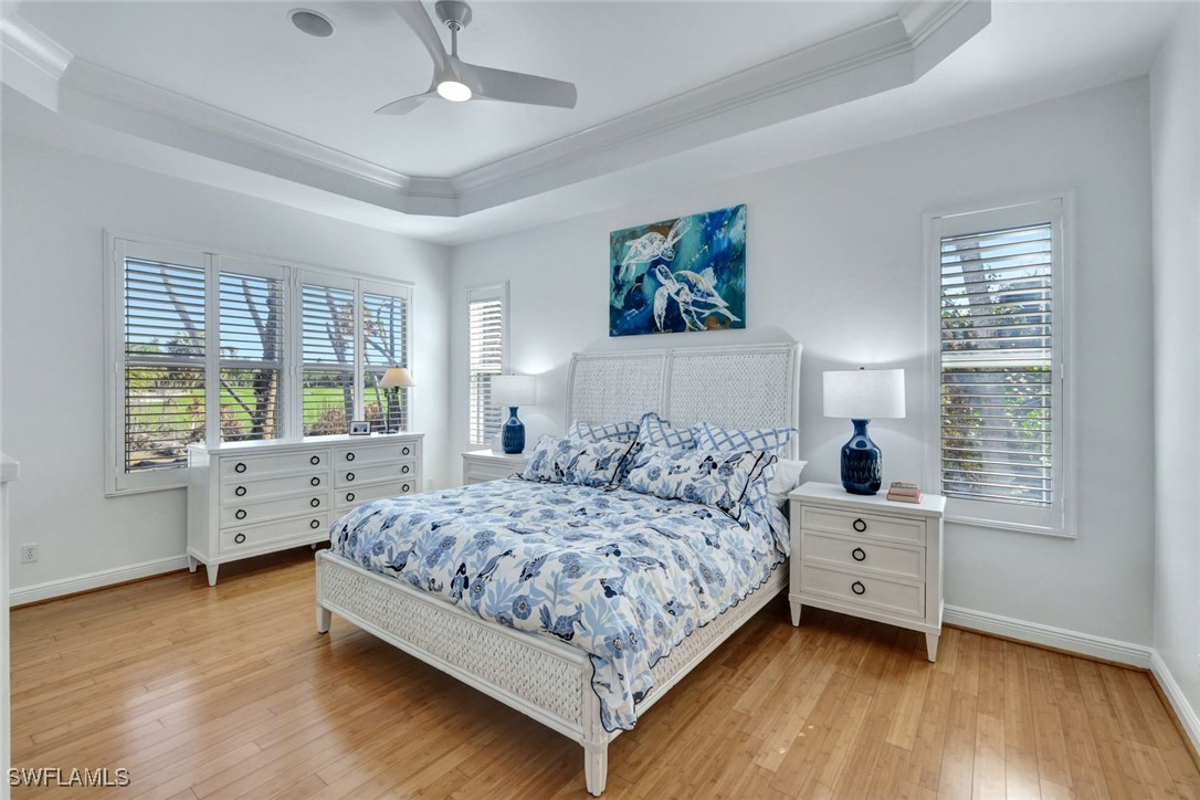 2450 Wulfert Road Sanibel, FL 33957 - Photo 25 of 44 a bedroom with a bed and a large window