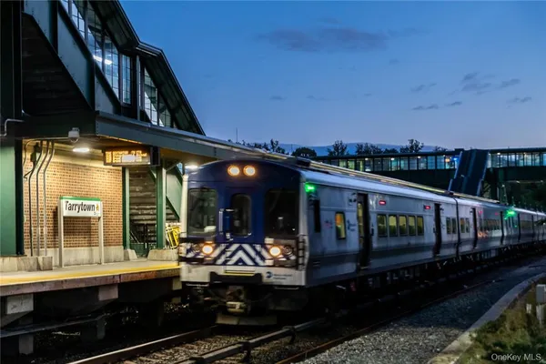 a view of a train that is sitting on the tracks