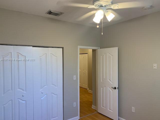 Silver Palm Homes Miami, FL 33170 - Photo 16 of 32 a view of a chandelier fan and closet area
