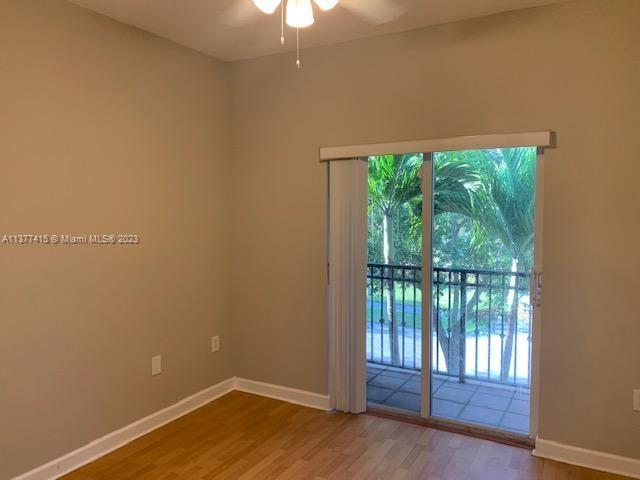 Silver Palm Homes Miami, FL 33170 - Photo 18 of 32 a view of an empty room with wooden floor and a window