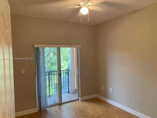 Silver Palm Homes Miami, FL 33170 - Photo 22 of 32 an empty room with wooden floor and windows