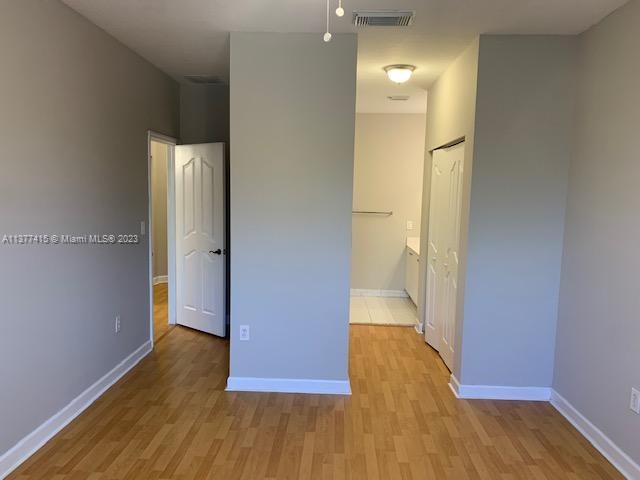 Silver Palm Homes Miami, FL 33170 - Photo 26 of 32 a view of a hallway with wooden floor