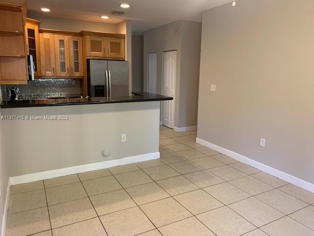 Silver Palm Homes Miami, FL 33170 - Photo 10 of 32 a kitchen with stainless steel appliances a refrigerator and a counter top