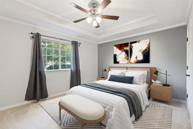 a bedroom with a bed and a painting on the wall