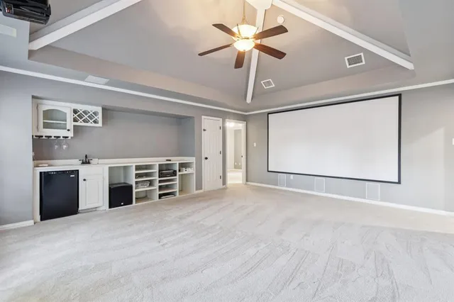 a view of a kitchen with a sink and a window