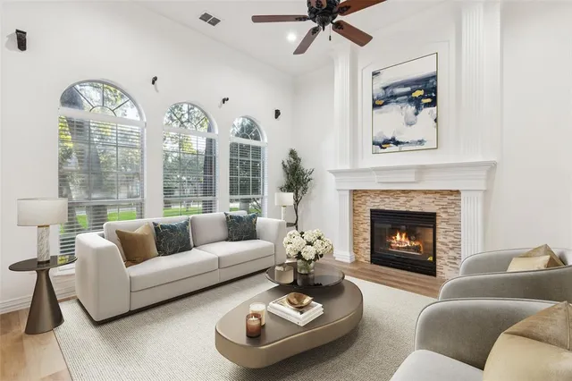 a living room with furniture and a fireplace
