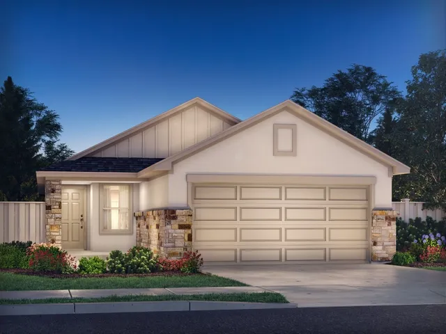 a view of a white house with large windows and plants