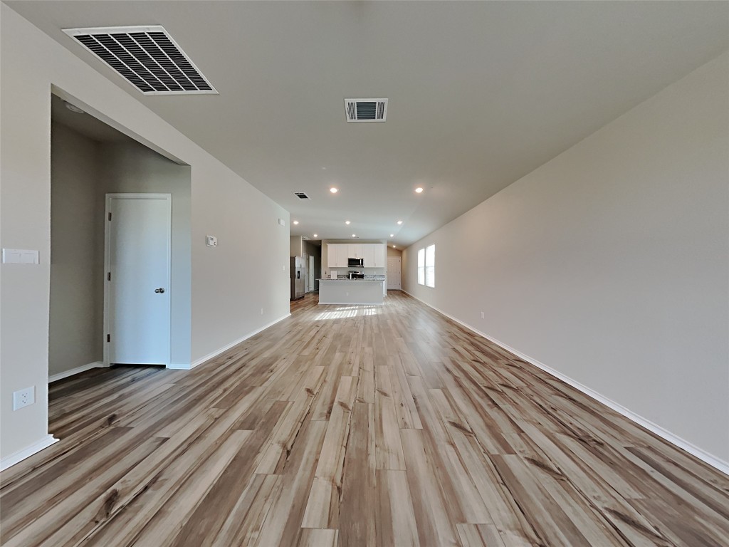 5236 Gallop Lane Georgetown, TX 78626 - Photo 4 of 13 a view of empty room with wooden floor