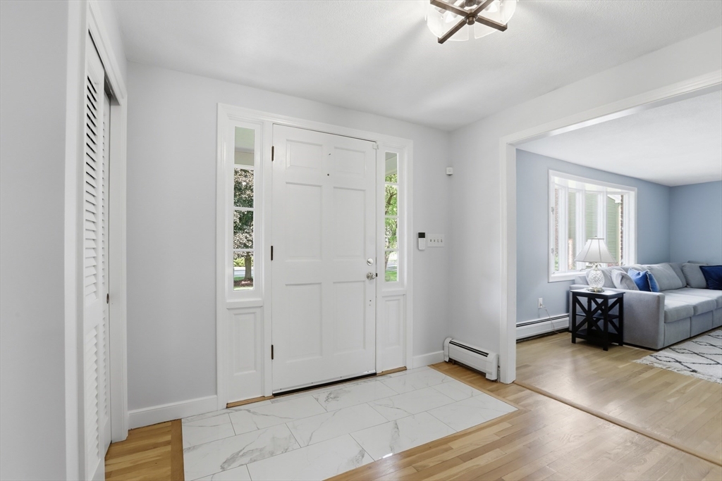 94 Johnson Road Winchester, MA 01890 - Photo 15 of 40 a view of livingroom with furniture and windows