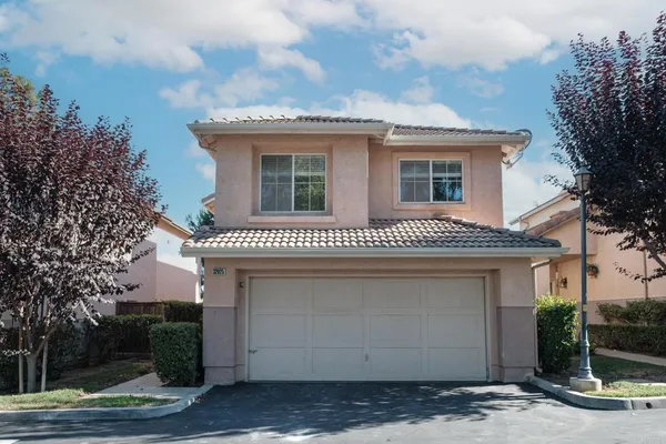 a front view of a house with a garage