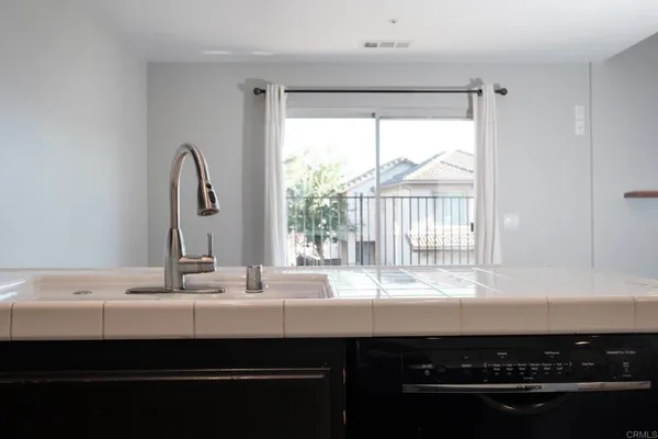 a bathroom with a sink and a window