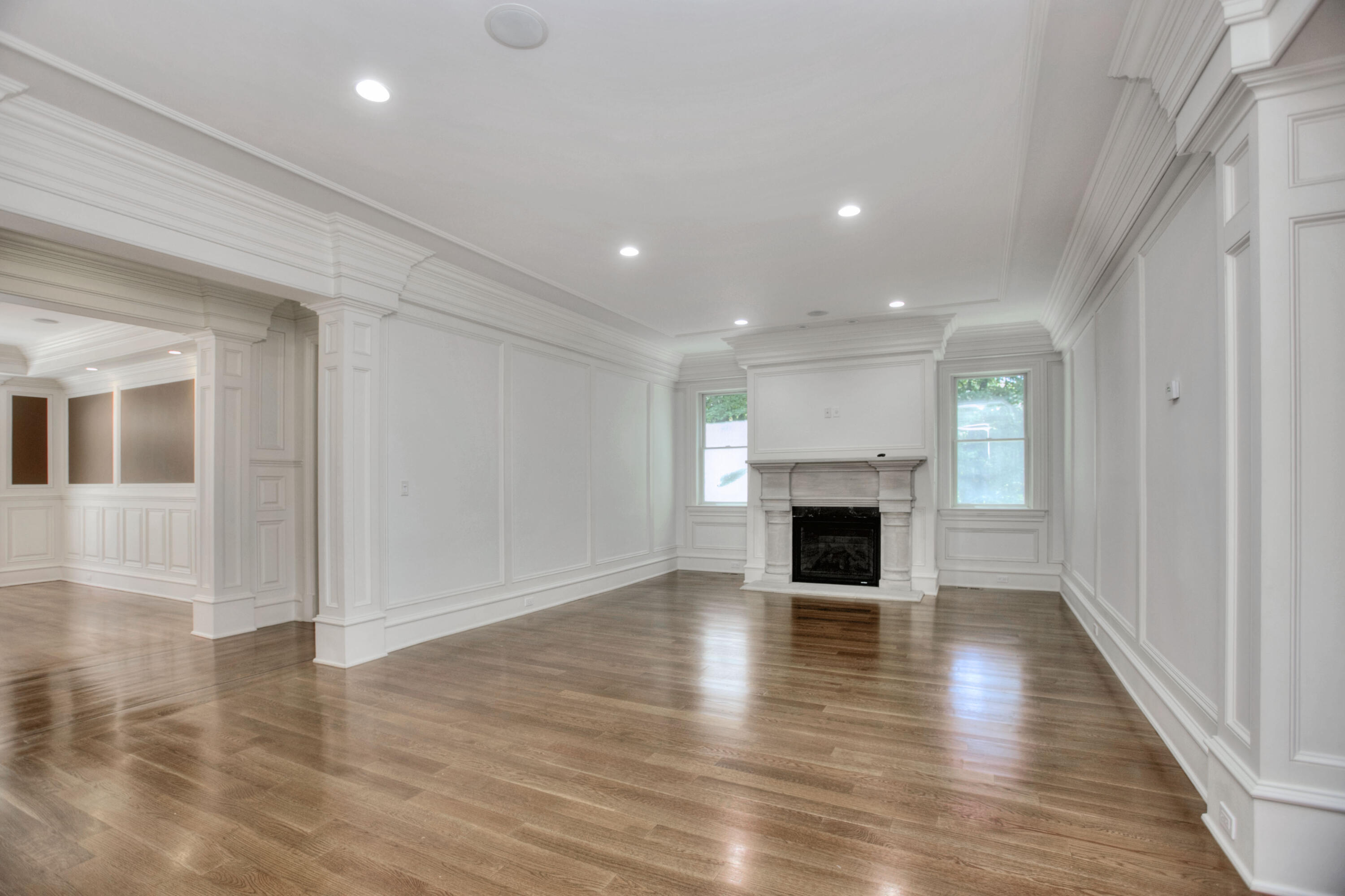 536 Roxbury Road Stamford, CT 06902 - Photo 11 of 38 an empty room with wooden floor fireplace and windows