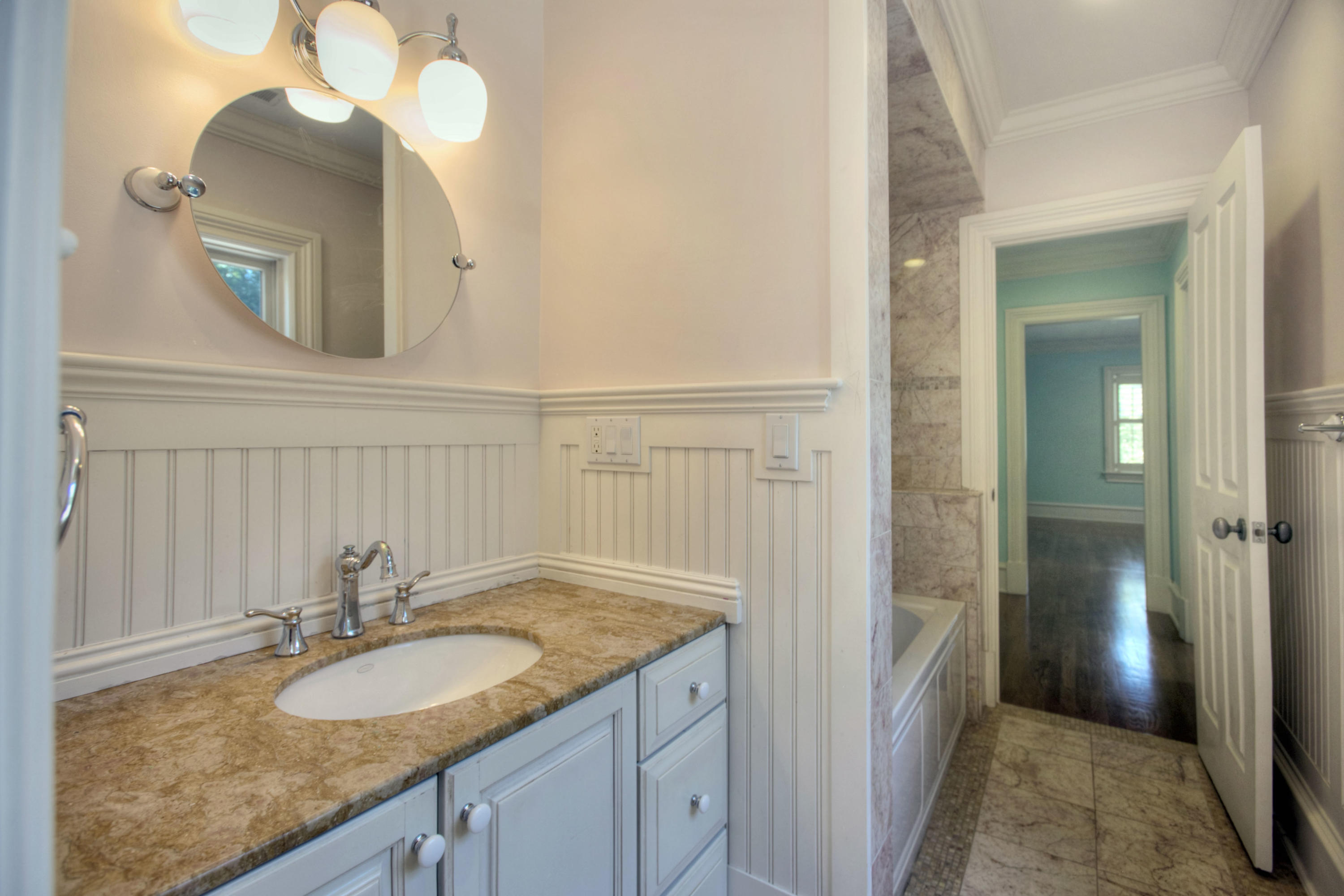 536 Roxbury Road Stamford, CT 06902 - Photo 20 of 38 a bathroom with a granite countertop sink and a mirror