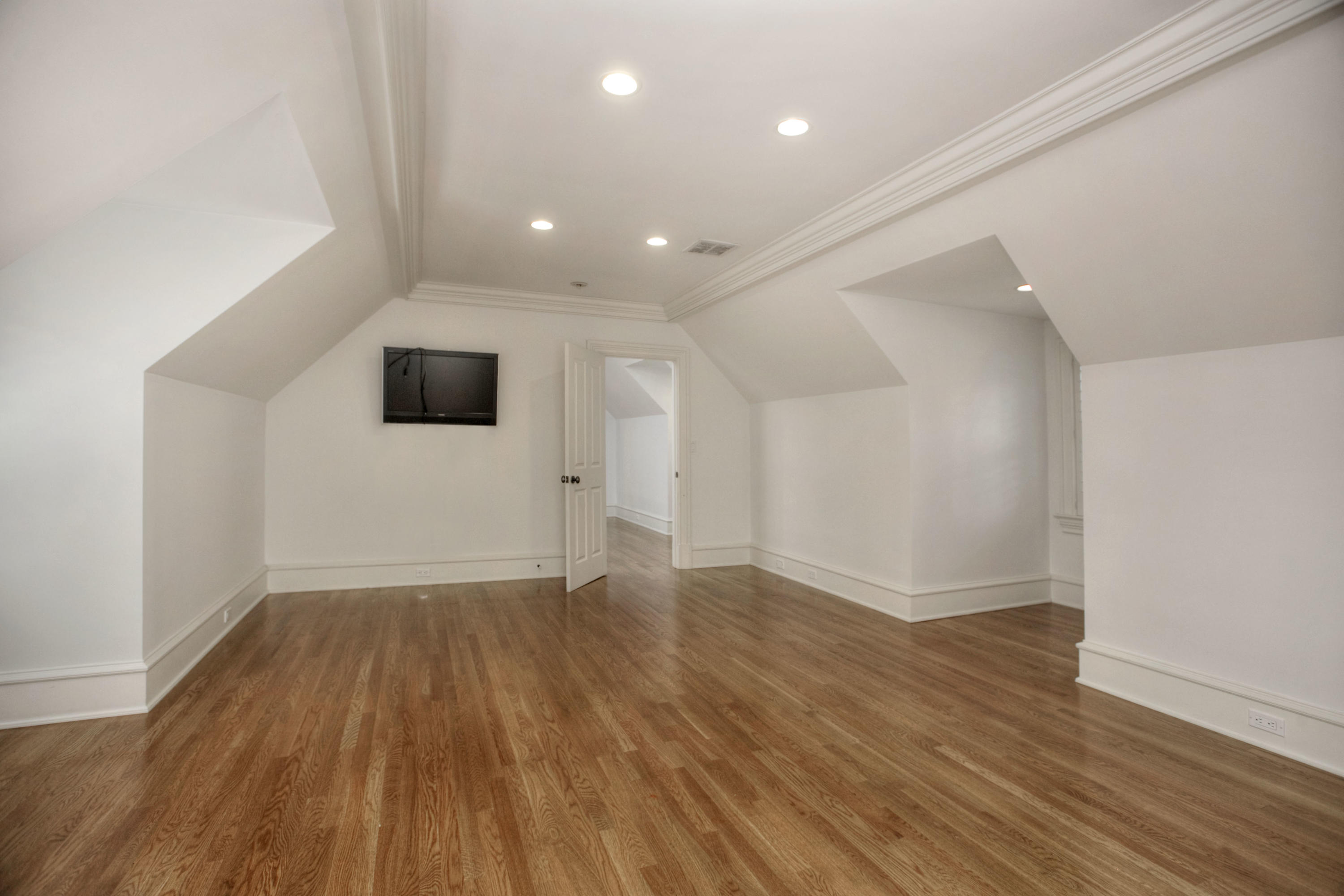 536 Roxbury Road Stamford, CT 06902 - Photo 21 of 38 an empty room with wooden floor and windows