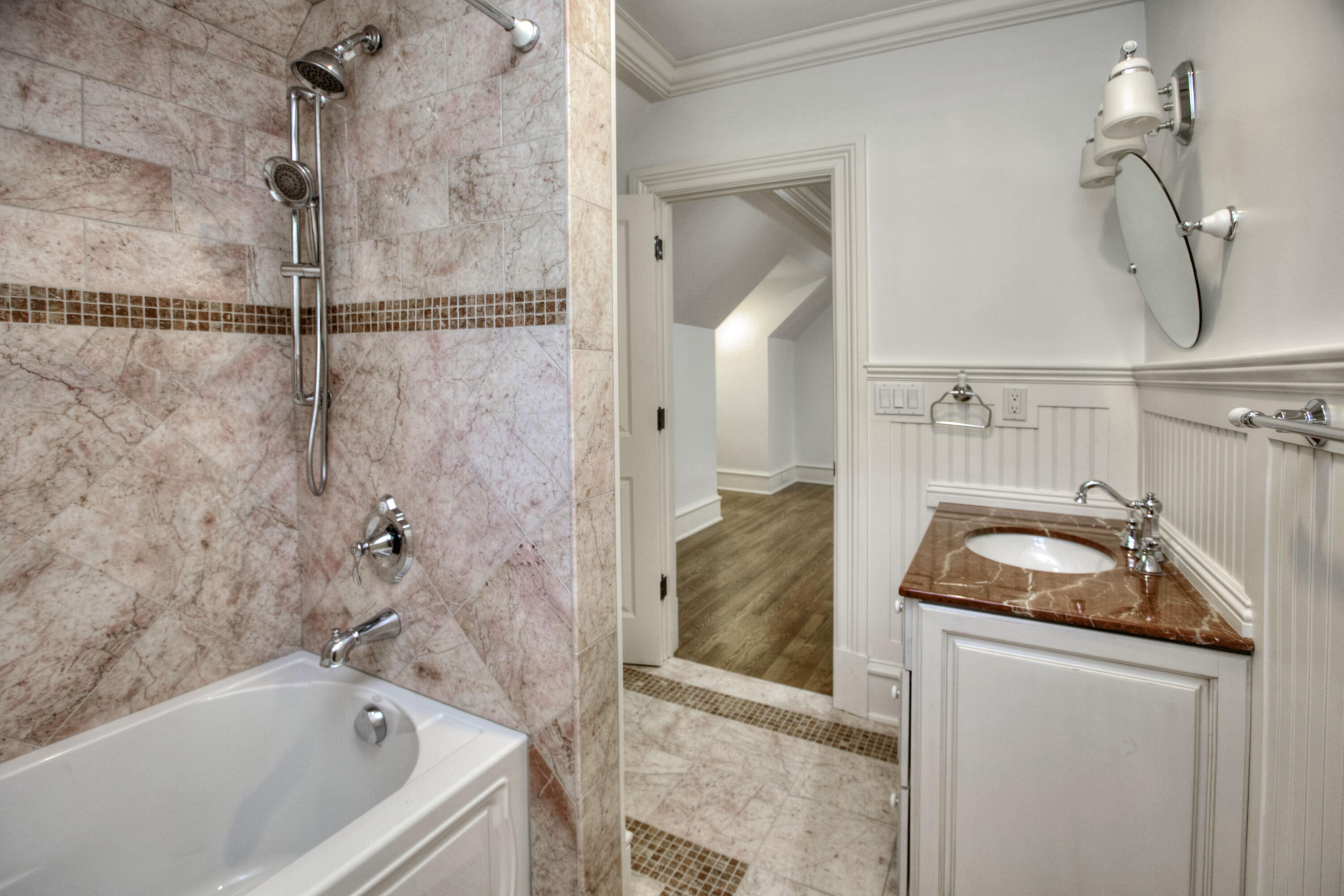 536 Roxbury Road Stamford, CT 06902 - Photo 24 of 38 a bathroom with a tub sink vanity and mirror