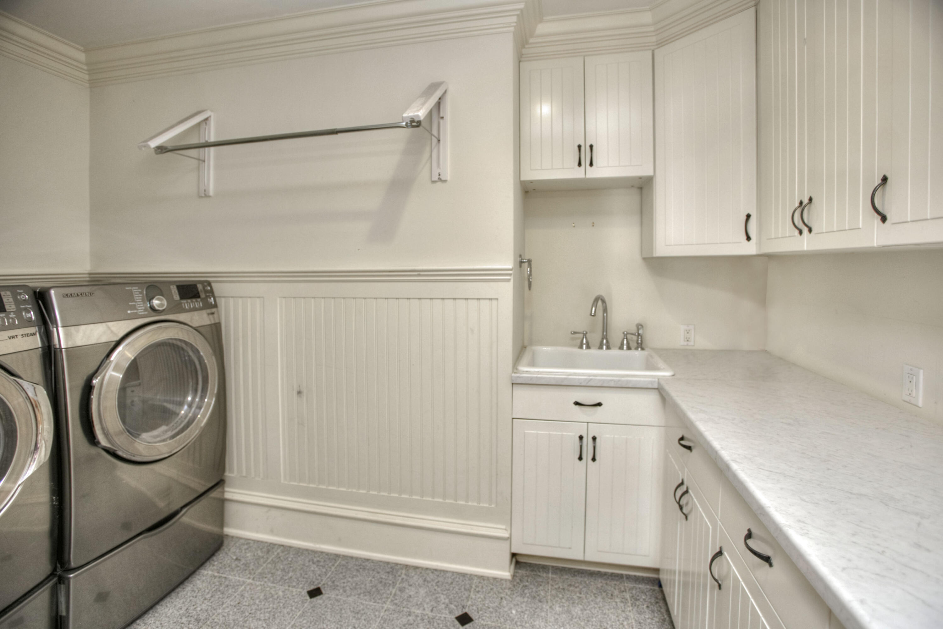536 Roxbury Road Stamford, CT 06902 - Photo 29 of 38 a view of a storage and utility room with washer and dryer