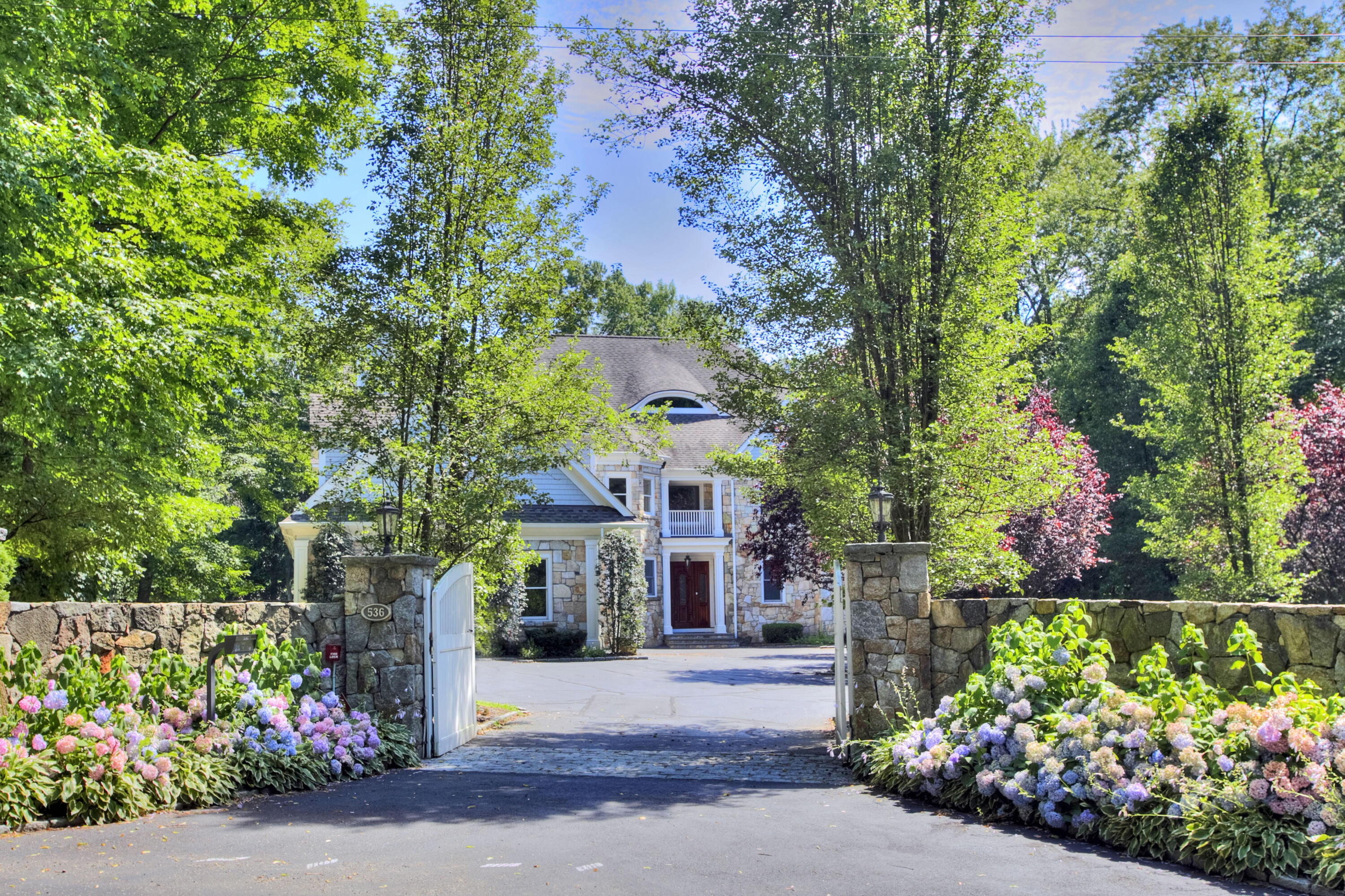 536 Roxbury Road Stamford, CT 06902 - Photo 35 of 38 front view of a house next to a yard