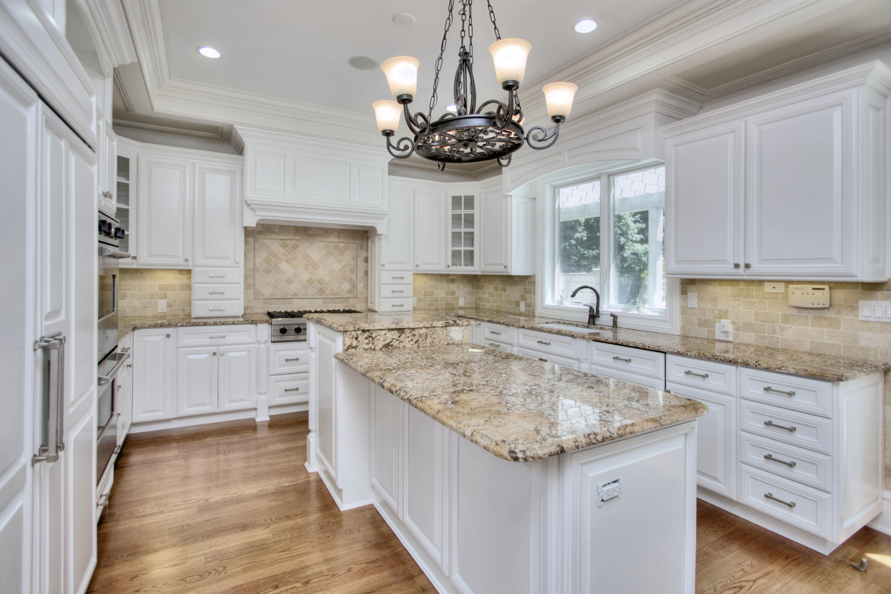 536 Roxbury Road Stamford, CT 06902 - Photo 5 of 38 a kitchen with stainless steel appliances granite countertop a sink stove and refrigerator