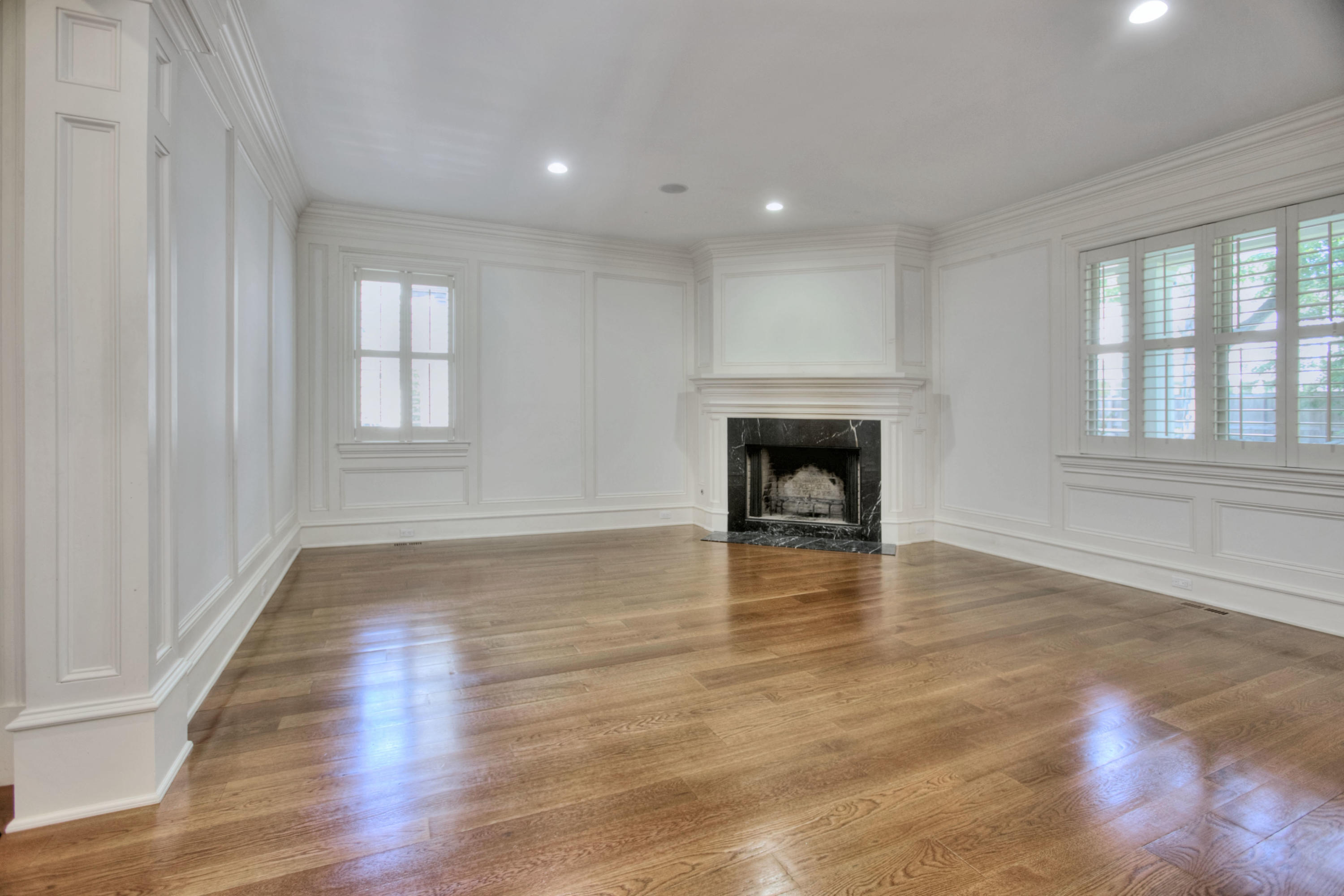 536 Roxbury Road Stamford, CT 06902 - Photo 10 of 38 an empty room with wooden floor fireplace and windows