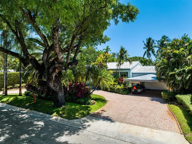 an aerial view of a house with outdoor space
