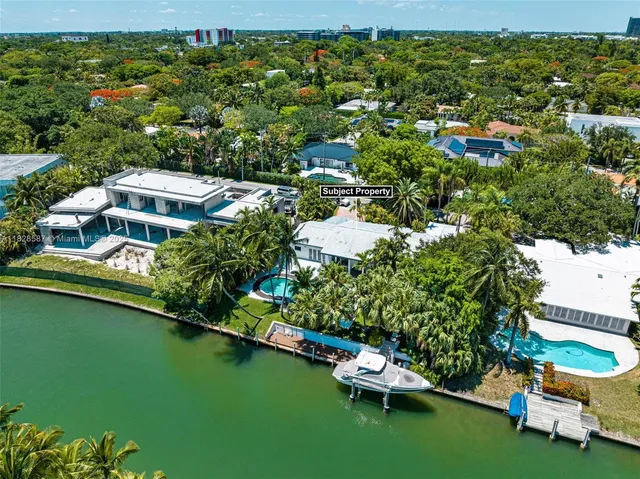 a view of a lake with houses in the back