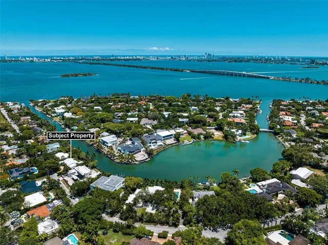 a view of a lake with boats and trees