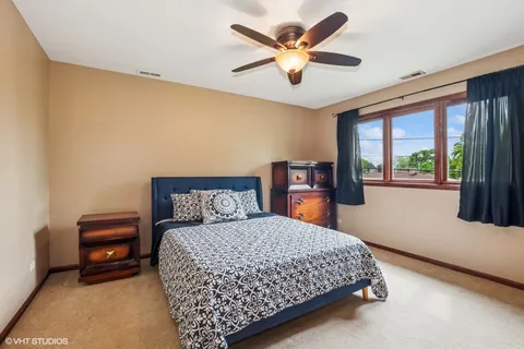 a bedroom with a large bed and a large window