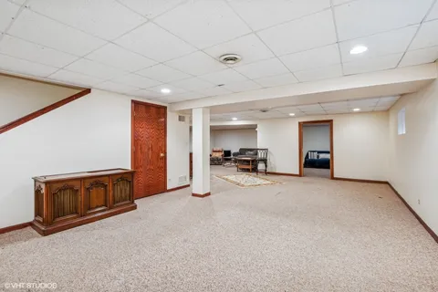 a view of a livingroom with furniture and a flat screen tv