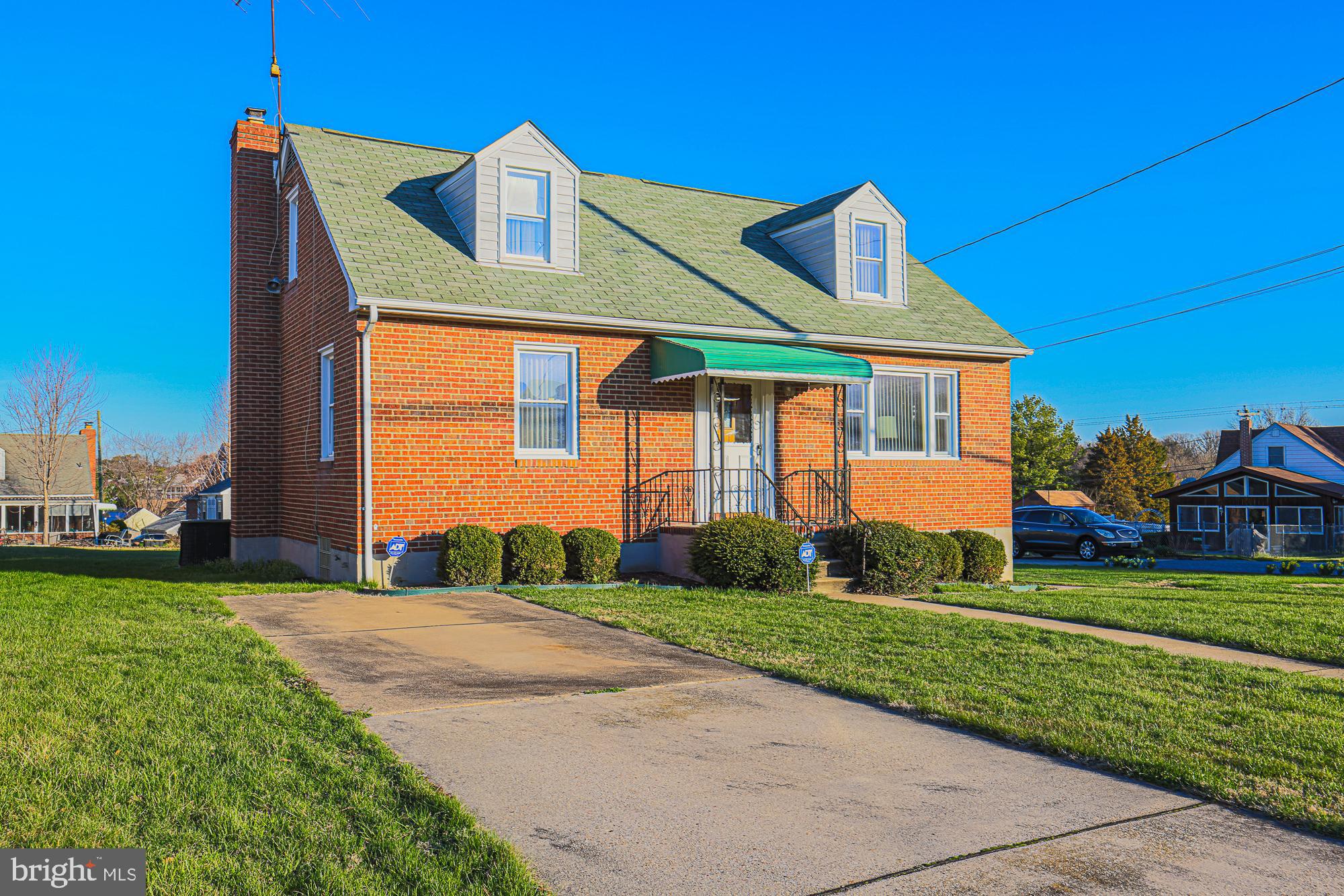 8506 Coco Road Baltimore, MD 21237 - Photo 1 of 39 a front view of a house with a yard