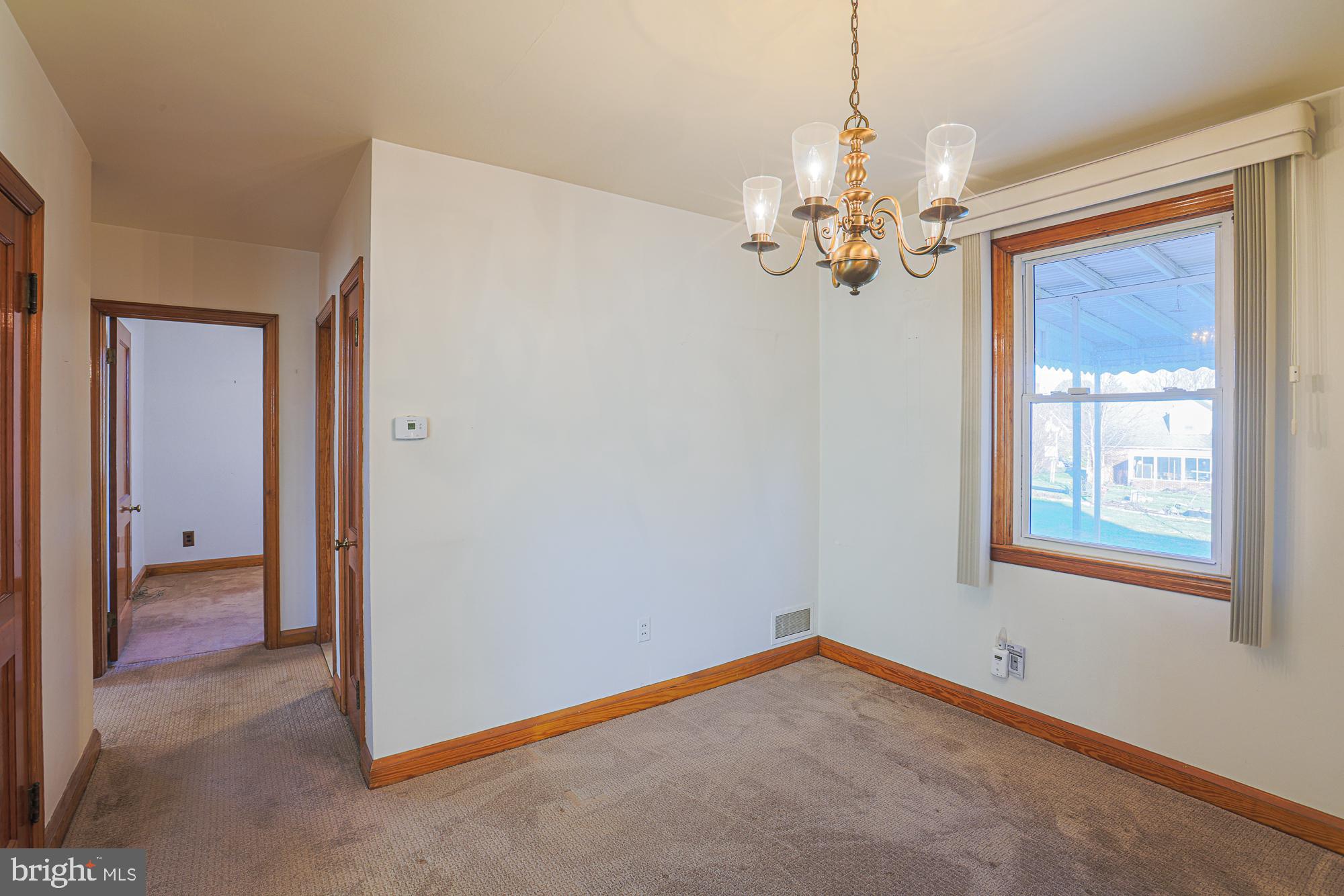 8506 Coco Road Baltimore, MD 21237 - Photo 12 of 39 a view of an empty room with a window
