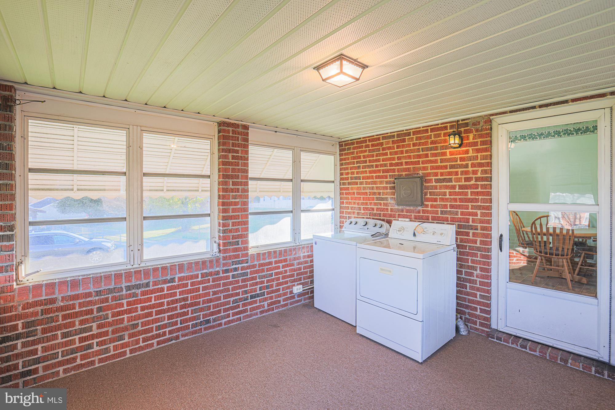 8506 Coco Road Baltimore, MD 21237 - Photo 18 of 39 a spacious bedroom with a balcony and large window