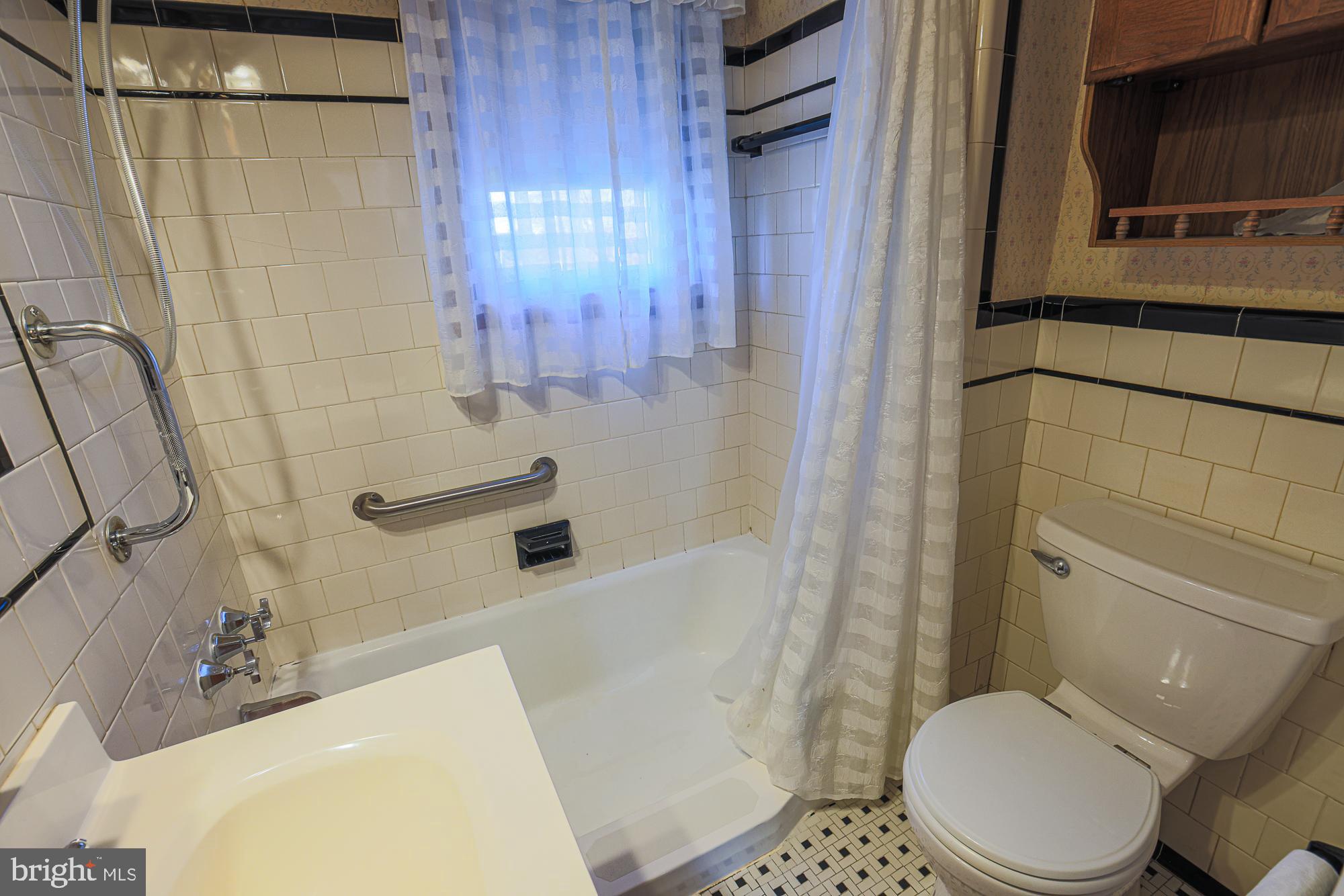 8506 Coco Road Baltimore, MD 21237 - Photo 20 of 39 a bathroom with a sink toilet and shower