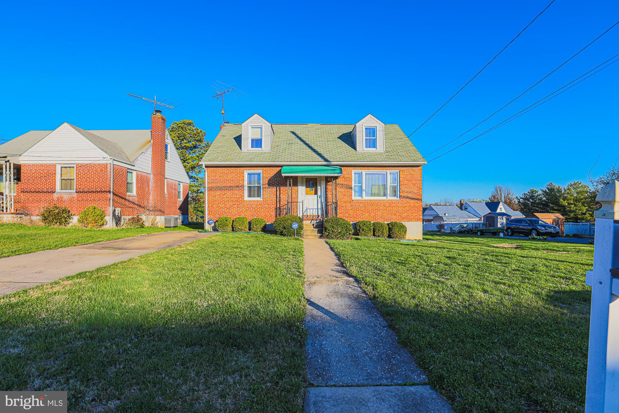 8506 Coco Road Baltimore, MD 21237 - Photo 2 of 39 a front view of a house with a yard