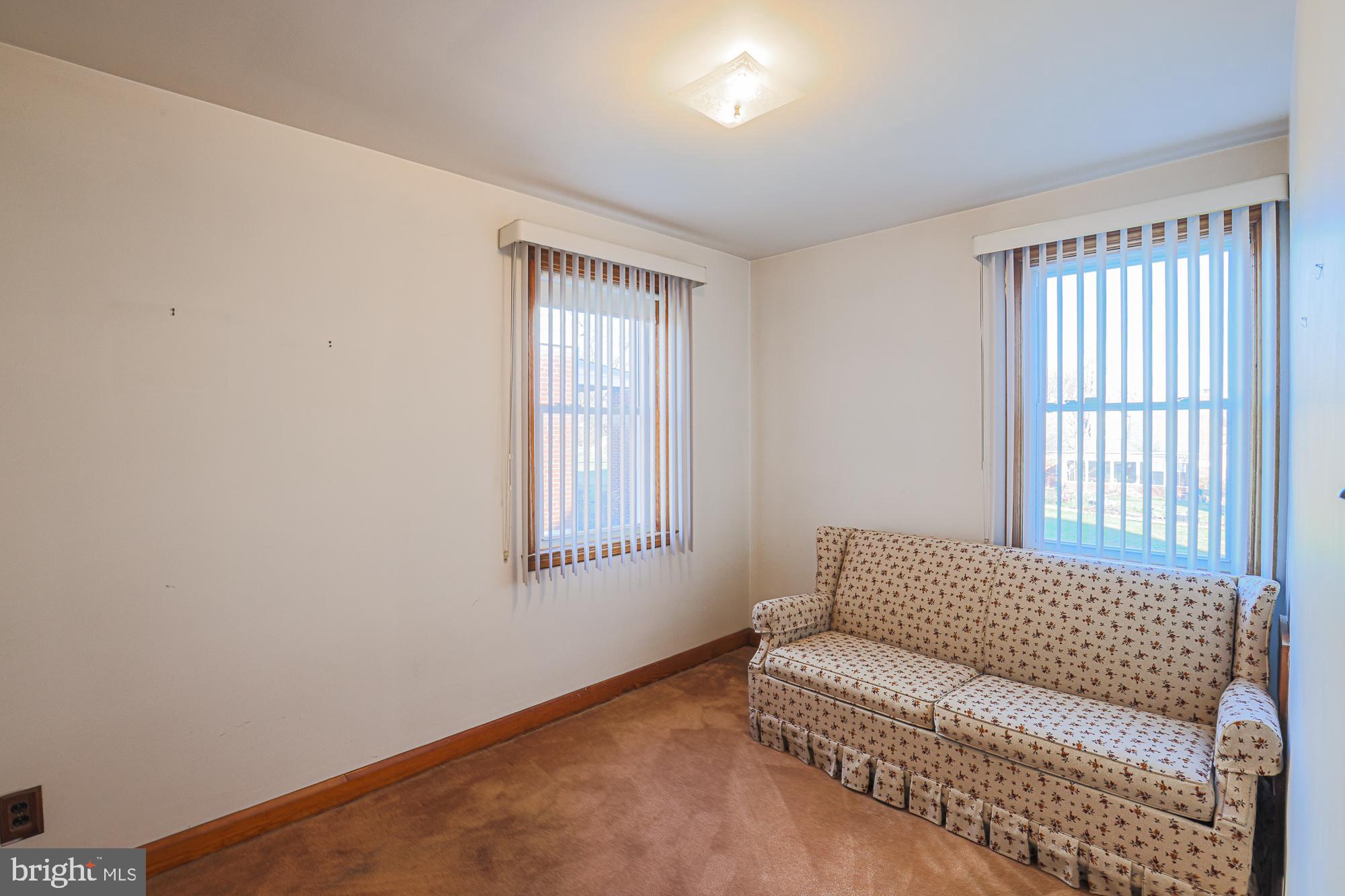 8506 Coco Road Baltimore, MD 21237 - Photo 23 of 39 a living room with furniture and a window