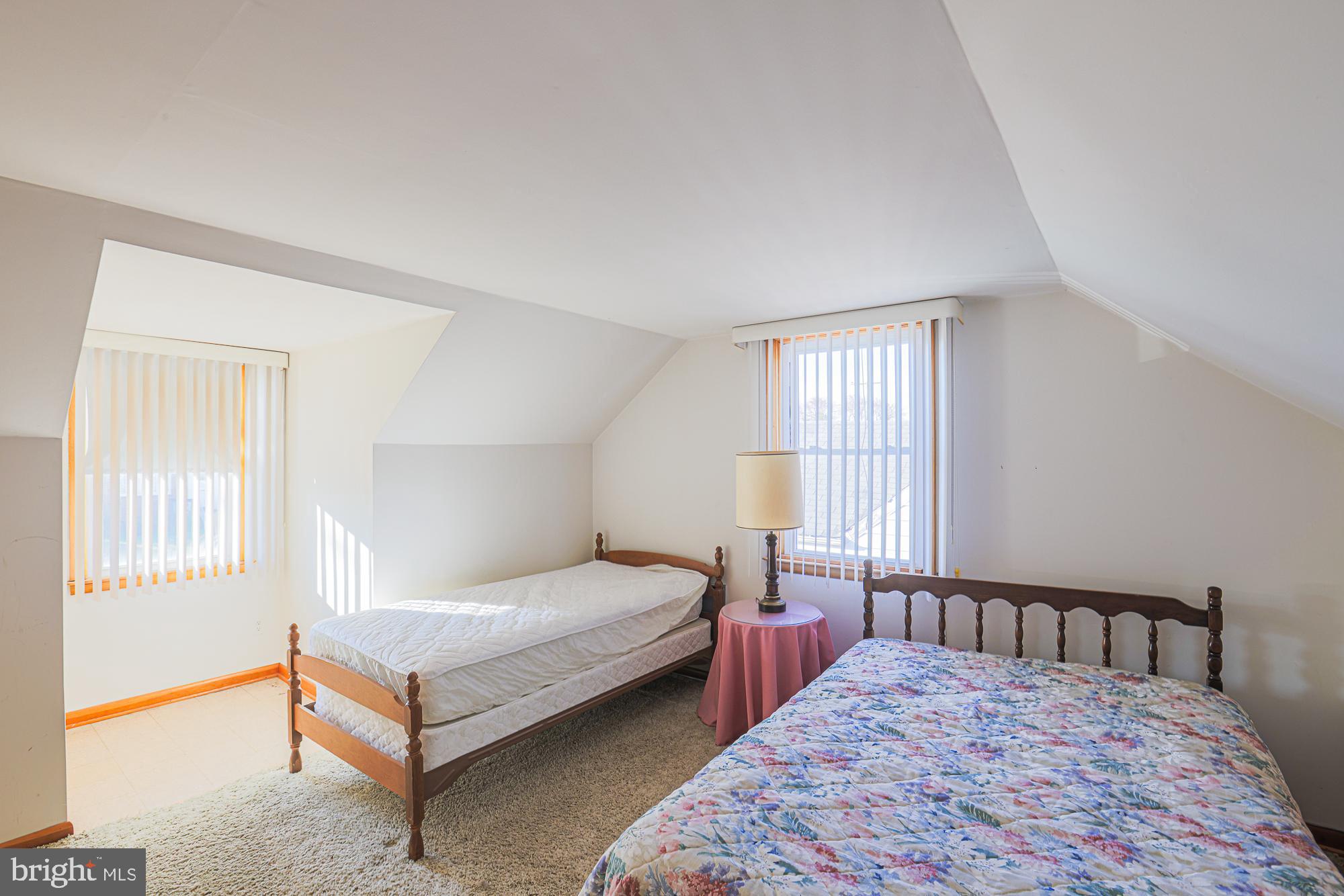 8506 Coco Road Baltimore, MD 21237 - Photo 24 of 39 a bedroom with a bed and a window