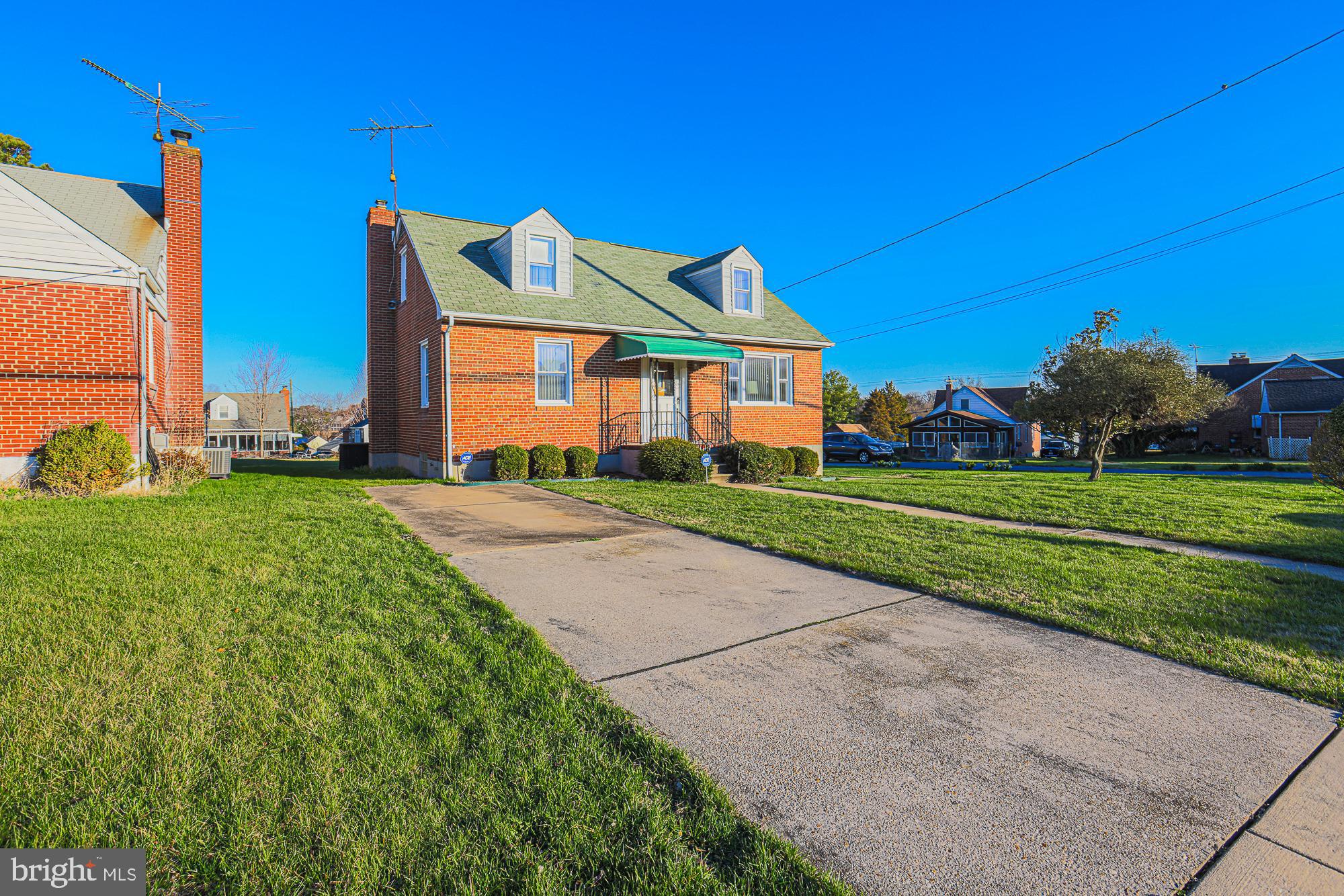 8506 Coco Road Baltimore, MD 21237 - Photo 3 of 39 a front view of a house with a yard